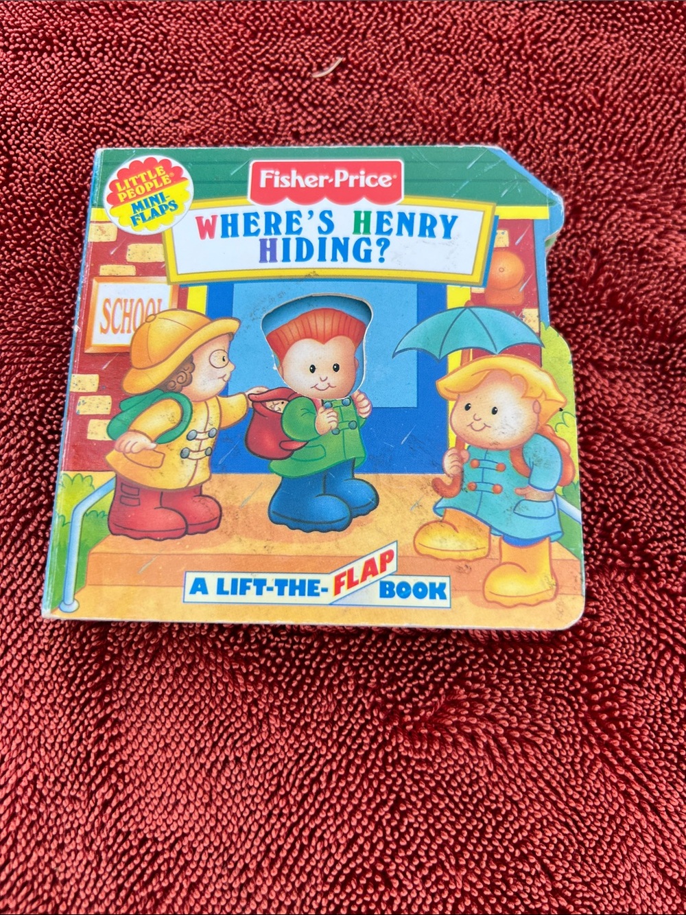 Fisher-Price Where's Henry Hiding? Board Book - Blue, Green, Red, Yellow
